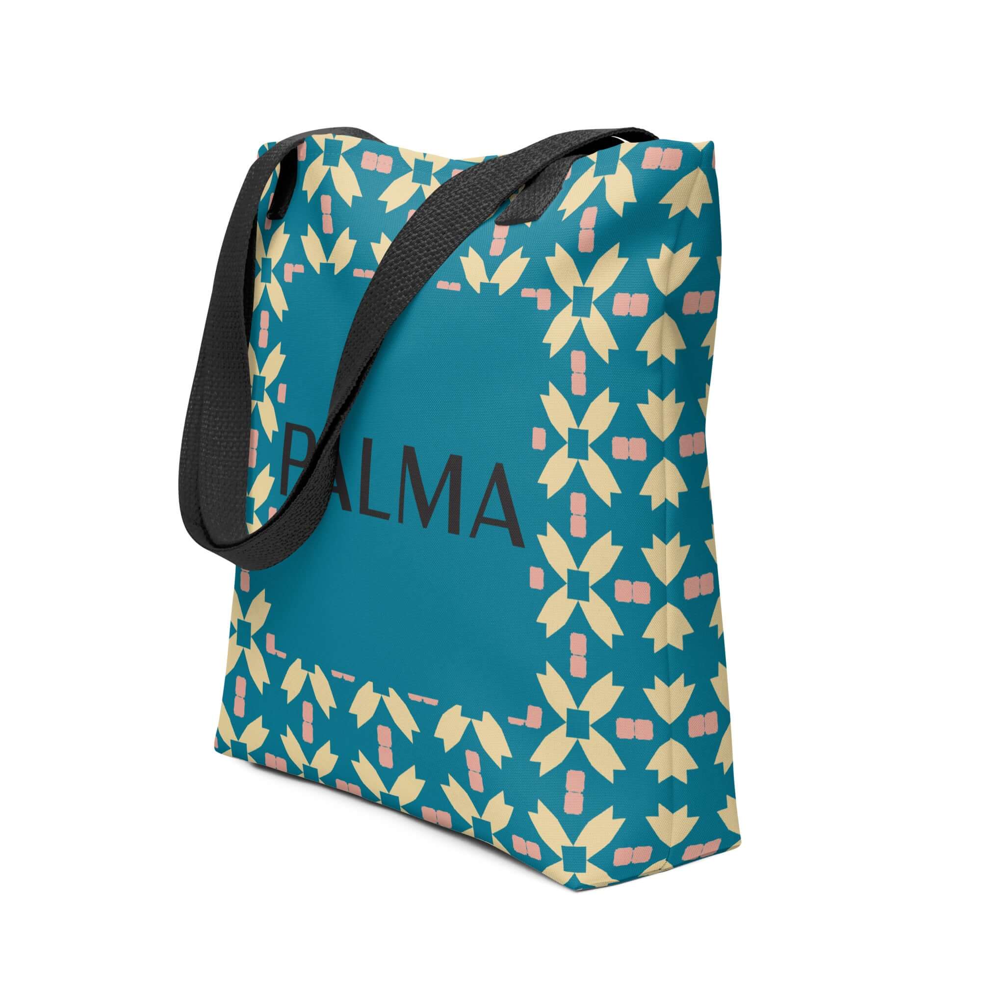 Side angle of PALMA tote bag featuring Teal Petal Grid pattern with black handles