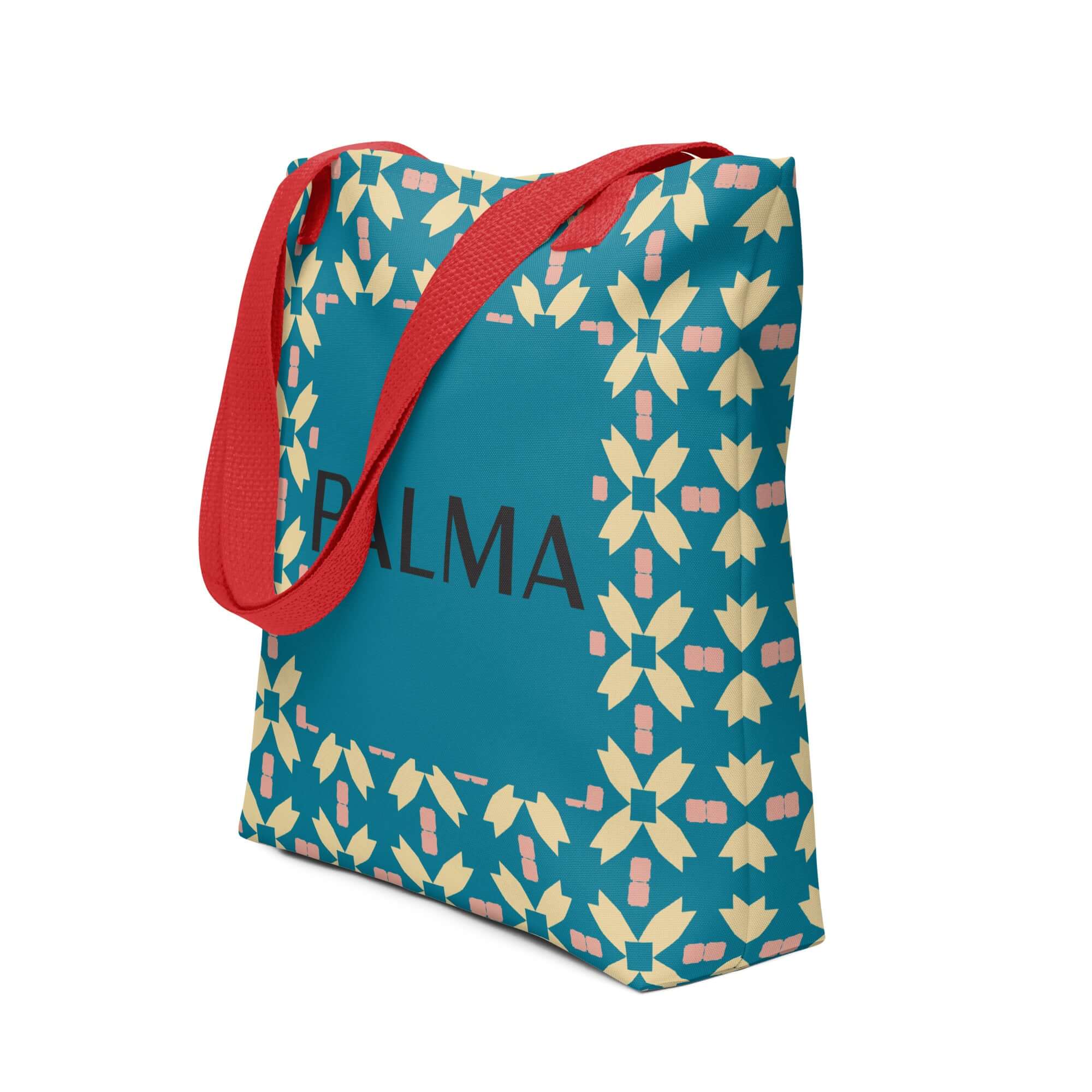 Side angle of PALMA tote bag featuring Teal Petal Grid pattern with red handles